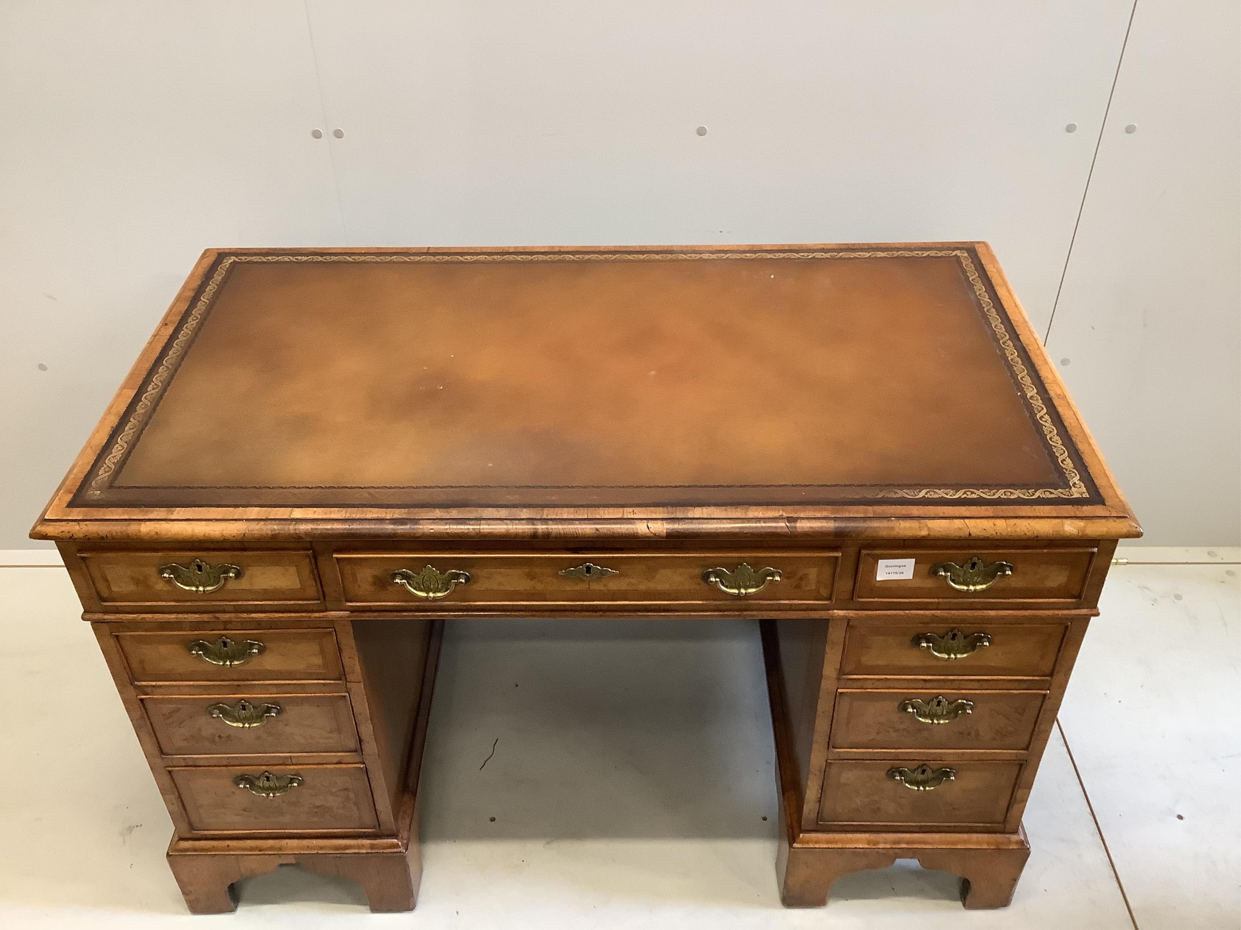 An 18th century style walnut pedestal desk, width 121cm, depth 67cm, height 77cm. Condition - good